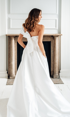The asymmetrical bow at the back is a stand out feature 