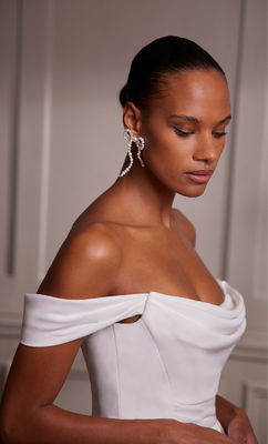 This versatile piece appeals to both modern and traditional brides who want a clean and luxe look