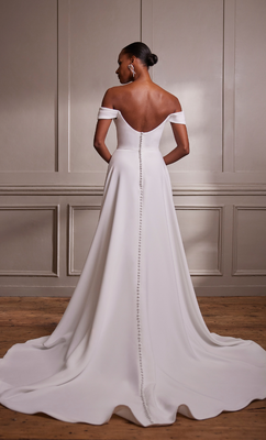 We adore the rear of the dress, with the flowing train and full length buttons