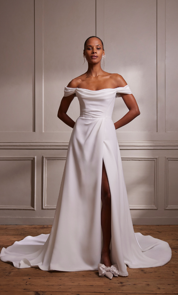 This Savannah Miller wedding dress features luxurious matt stretch crepe and exquisite draping