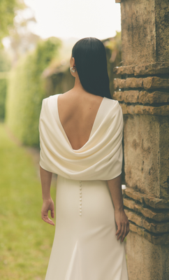 The drape of the cape back adds an elegant feature