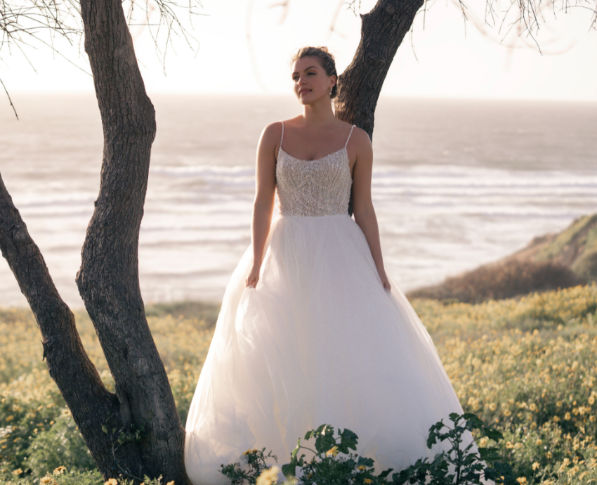 A contemporary ball gown with pearl detailing by Allure Couture