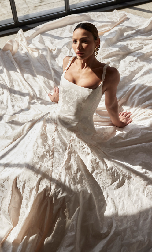 Bella is an exquisite style in blush duchess floral Jacquard fabric