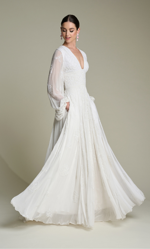 The hand-beaded gown has the stunning drape