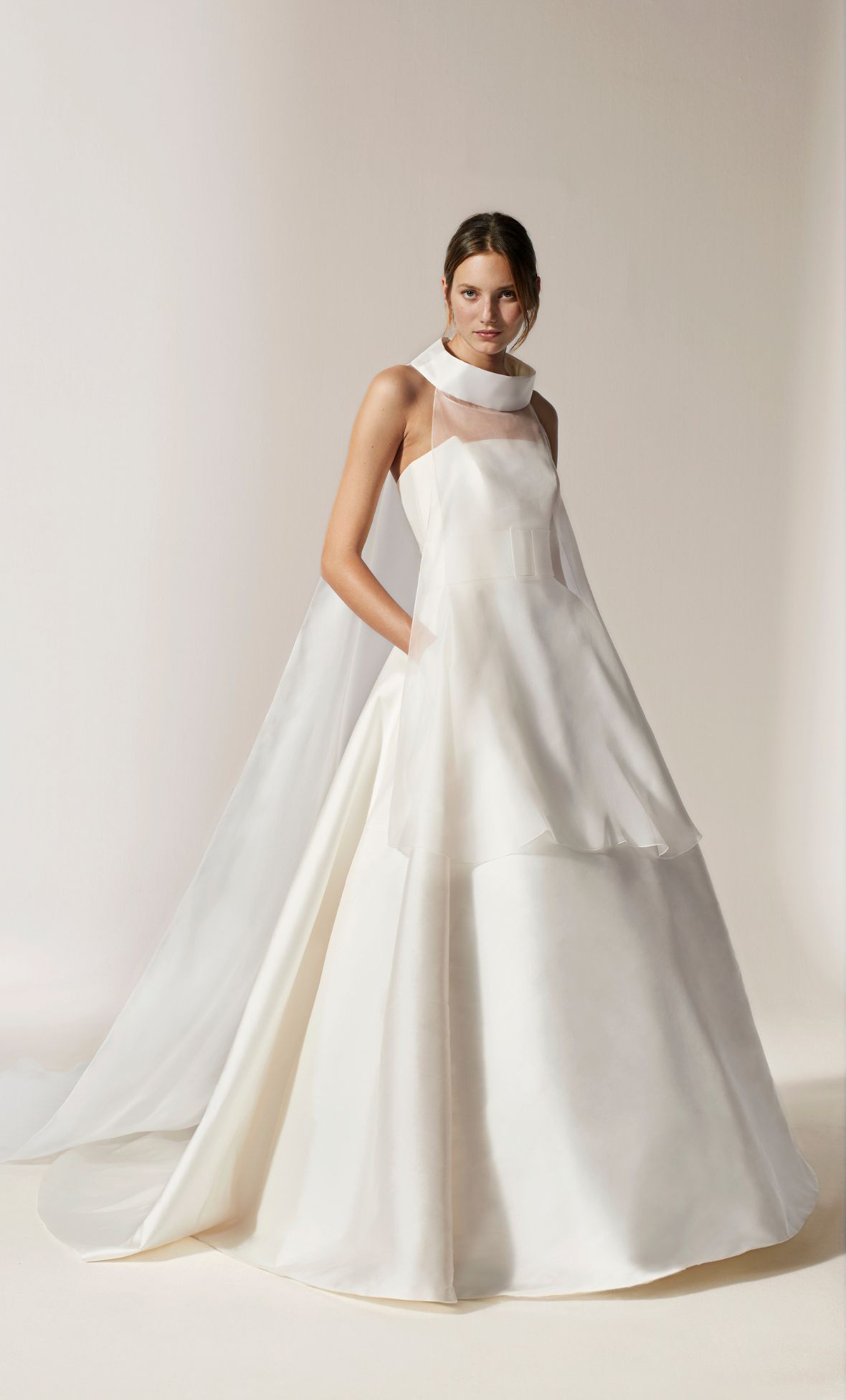 An architectural gown with layered organza cape from the Jesus Peiro 2026 Collection 