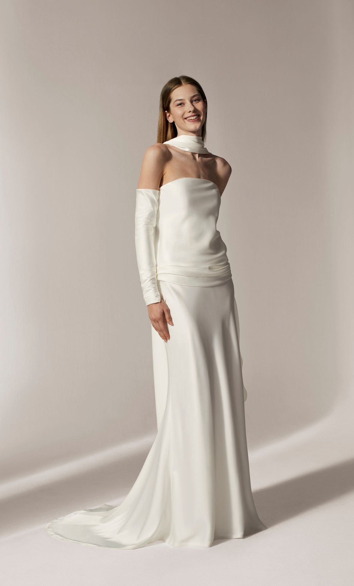 Accessorised to perfection: Minimalist gown with detachable sleeves and neck scarf