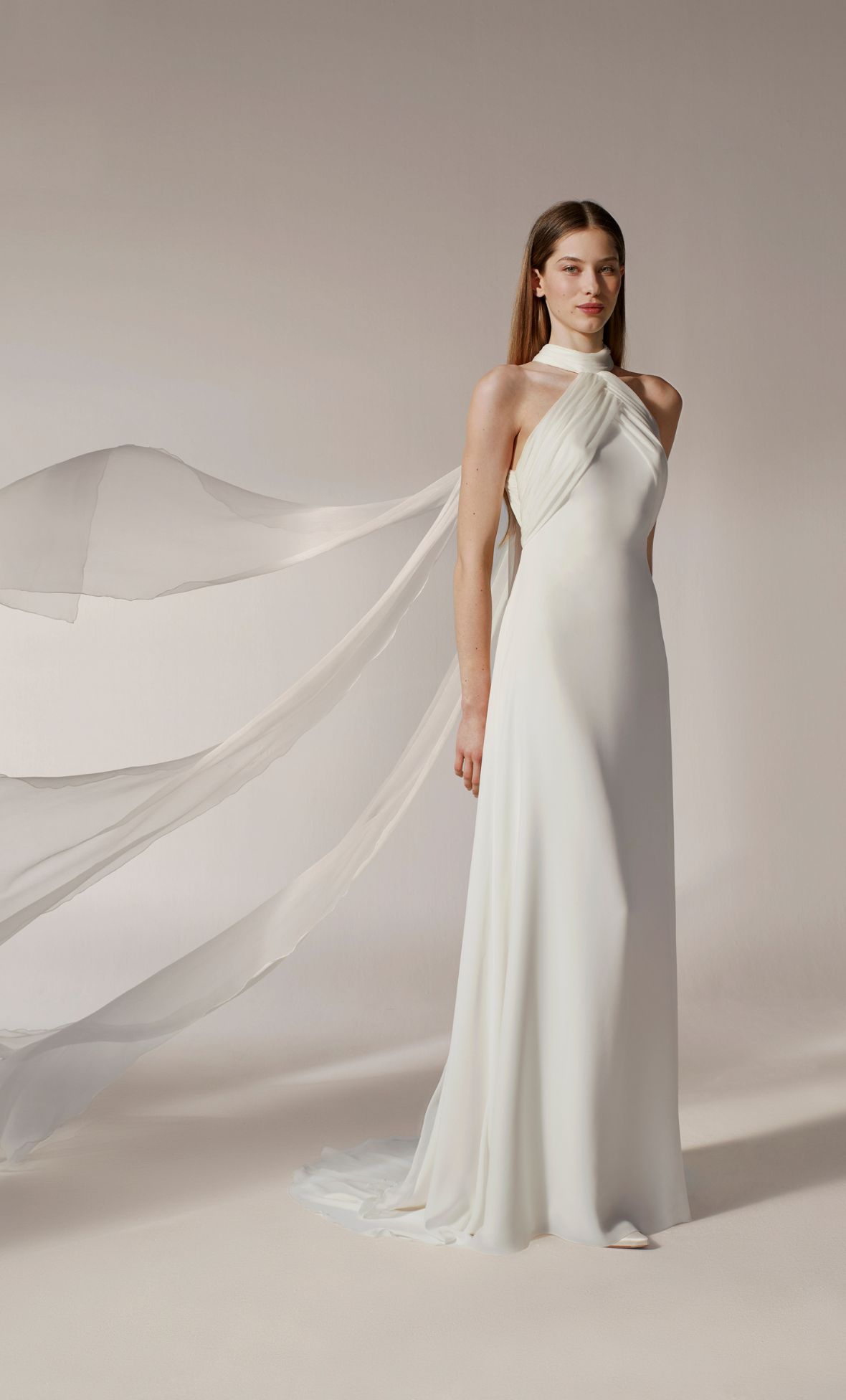 We love this halter gown with flowing details from Jesus Peiro's 2026 bridal line