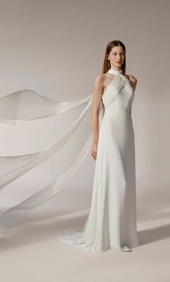 We love this halter gown with flowing details from Jesus Peiro's 2026 bridal line