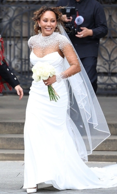 Over 5,000 pearls and beads were individually applied across the illusion jacket and veil. Image PA