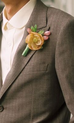 Grooms are swapping fresh buttonholes for decorative brooches and keepsake pieces